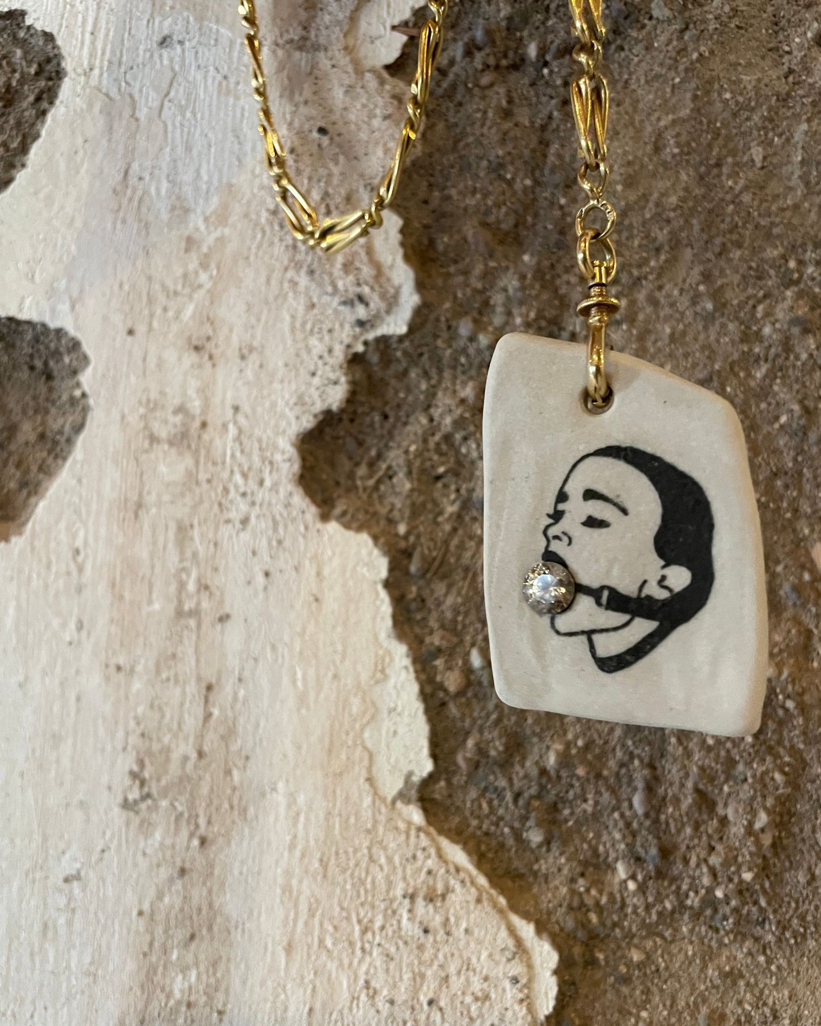 Nyssa Mariah Barrick, Seven Settings, ceramic pendant set with a single stone