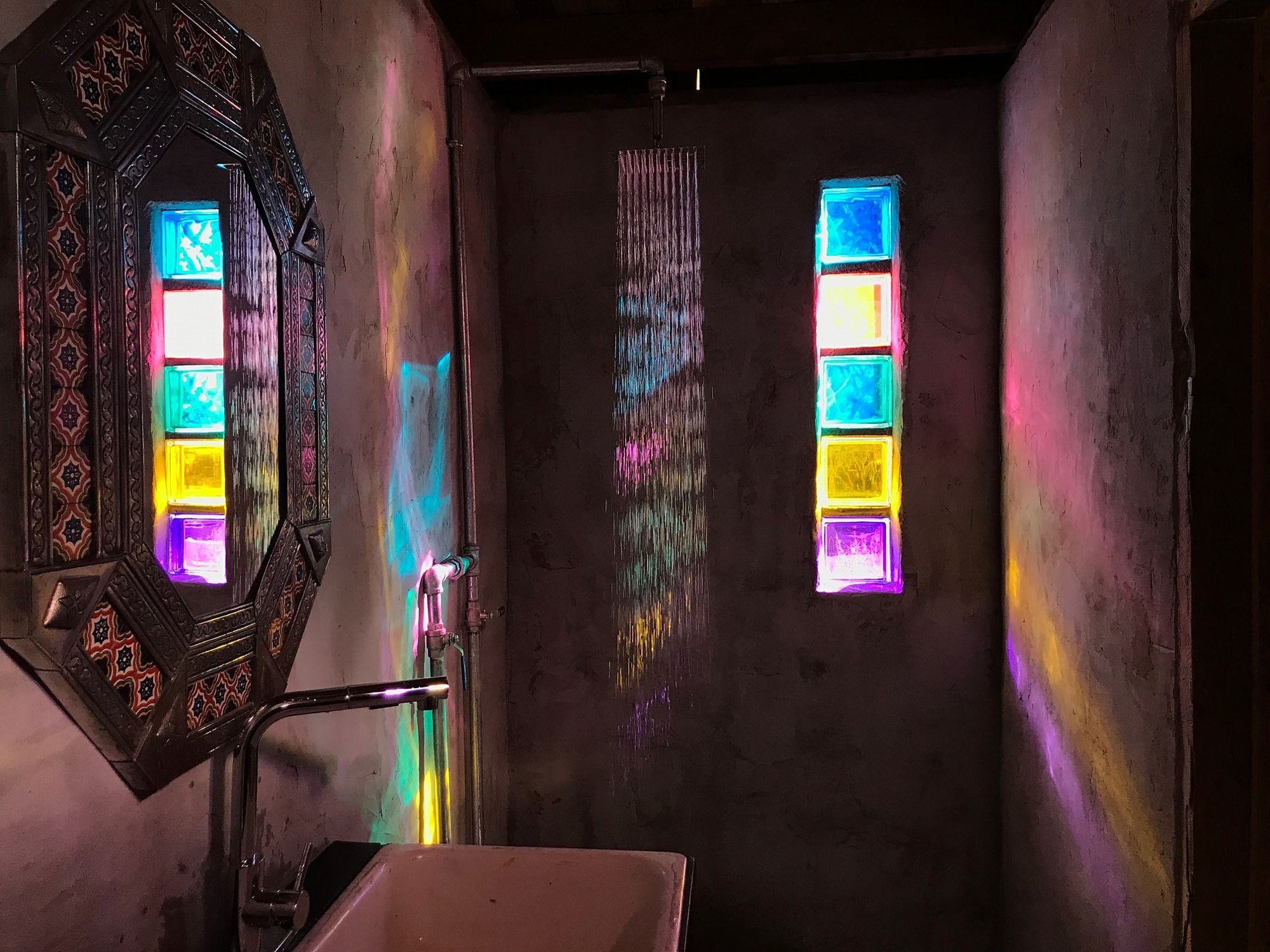Coloured glass blocks in a bathroom at Las Sombras